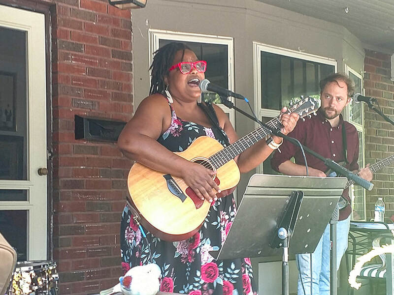 Paisha of The Paisha Thomas Trio singing soulful music at Troy Ohio Porch Fest 2024