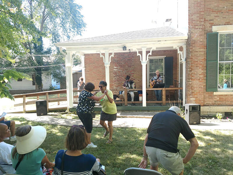 two women dance during a performance by Uncle Lou and the Polka Partners 